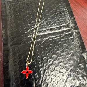 Elegant Gold tone Necklace with Red Pendant